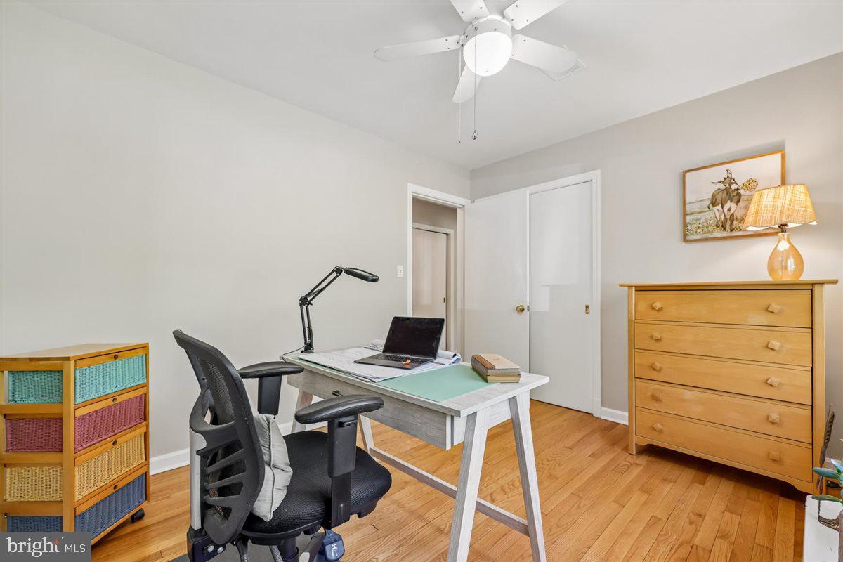 4318 Pinetree Road Rockville, MD 20853 - Photo 86 of 130 a view of a workspace with furniture and wooden floor