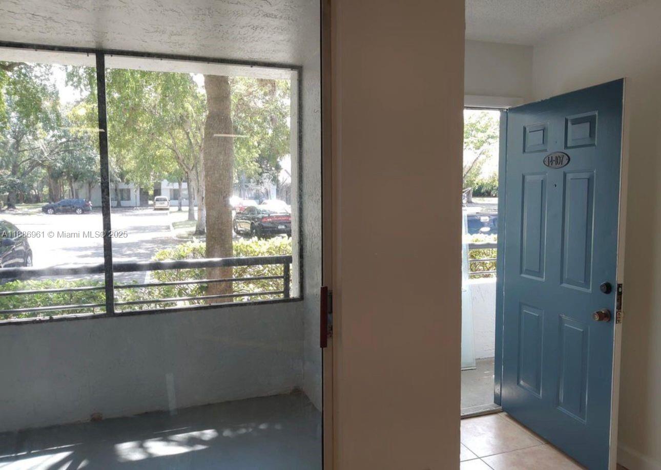 711 Lyons Road, Unit 14107 Coconut Creek, FL 33063 - Photo 11 of 24 a view of a room with a large window