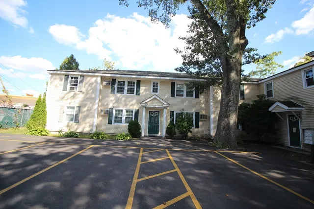 a front view of a house with yard
