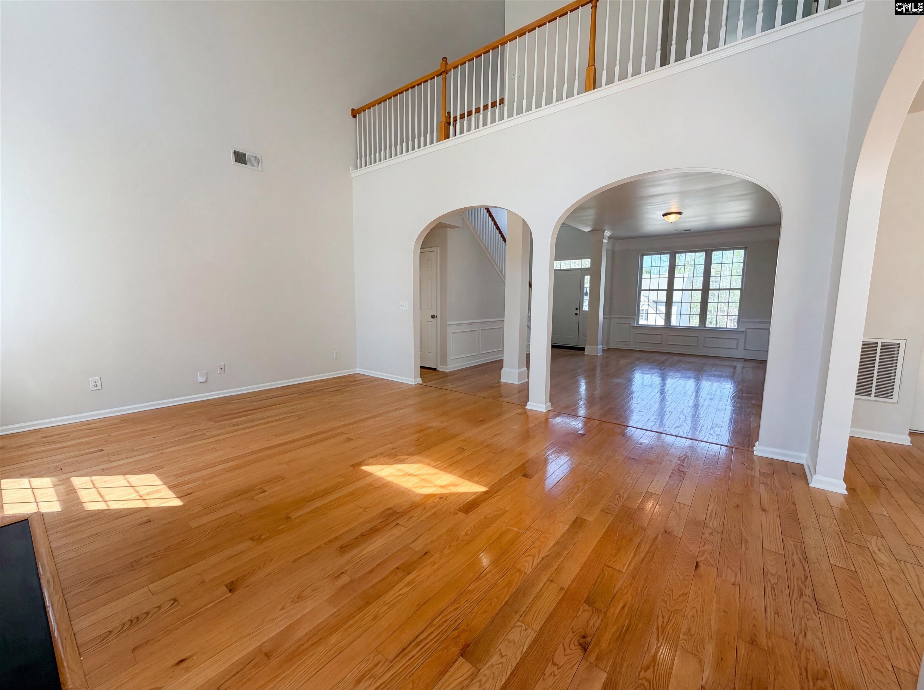 112 Coopers Hawk Circle Irmo, SC 29063 - Photo 18 of 26 a view of empty room with wooden floor and fan