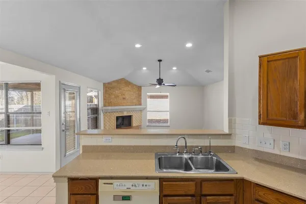 a kitchen with a sink cabinets and window