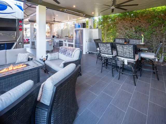 a outdoor space with lots of tables a garden view and chairs