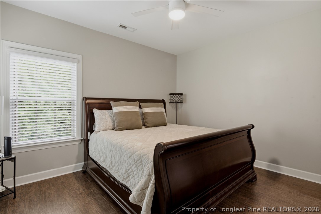 148 Heatherspring Way Spring Lake, NC 28390 - Photo 41 of 50 a bedroom with a bed and a window