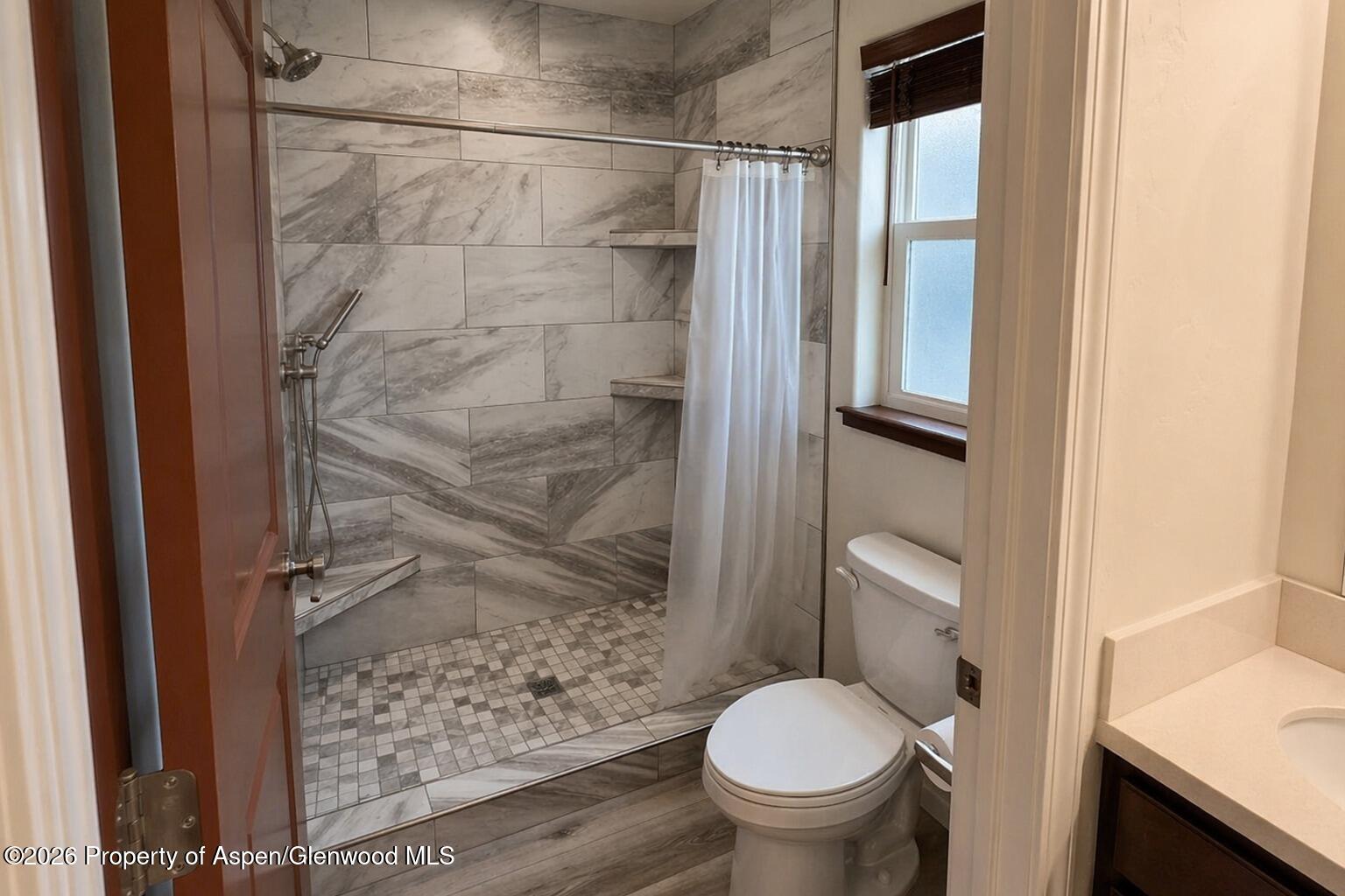 1648 Arabian Avenue Rifle, CO 81650 - Photo 5 of 15 a bathroom with a toilet and a shower