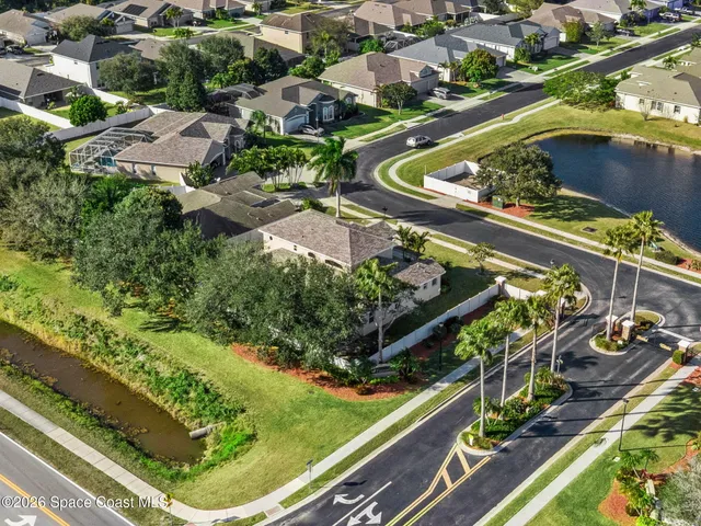 an aerial view of a house with a garden and plants