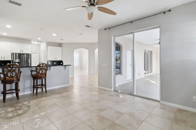 a kitchen with stainless steel appliances a microwave a stove a sink a microwave and a refrigerator