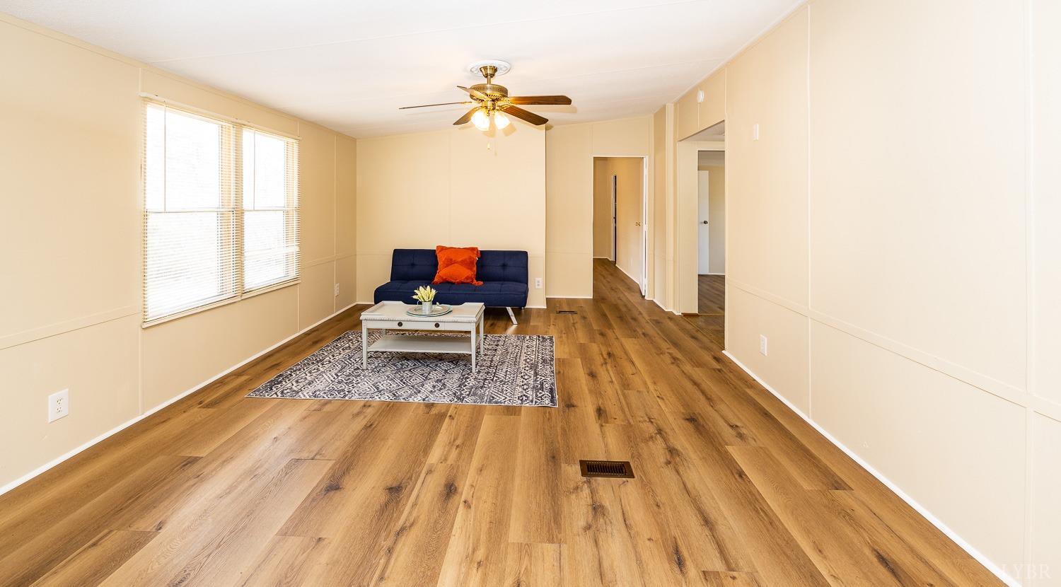 5893 Red House Road Appomattox, VA 24522 - Photo 22 of 28 a view of a living room with wooden floor and a window