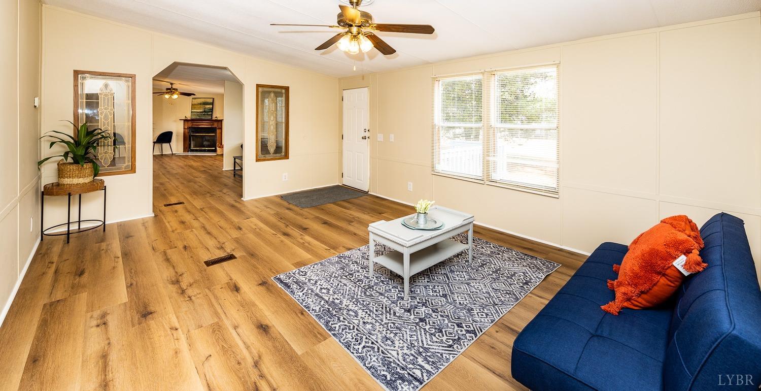 5893 Red House Road Appomattox, VA 24522 - Photo 24 of 28 a bedroom with a bed and wooden floor