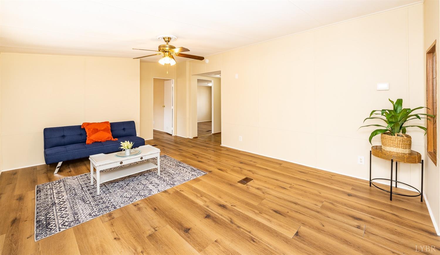 5893 Red House Road Appomattox, VA 24522 - Photo 25 of 28 a living room with furniture and a wooden floor