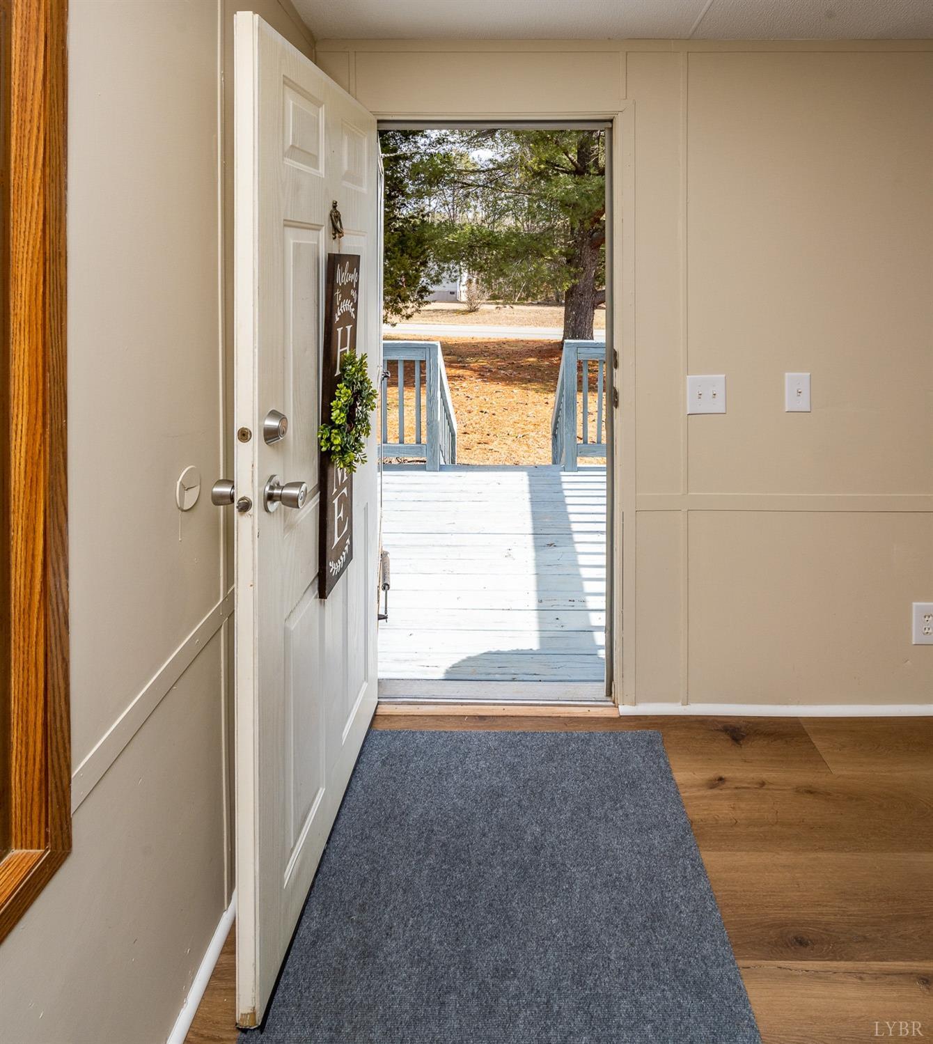 5893 Red House Road Appomattox, VA 24522 - Photo 27 of 28 a view of a hallway with wooden floor and a window