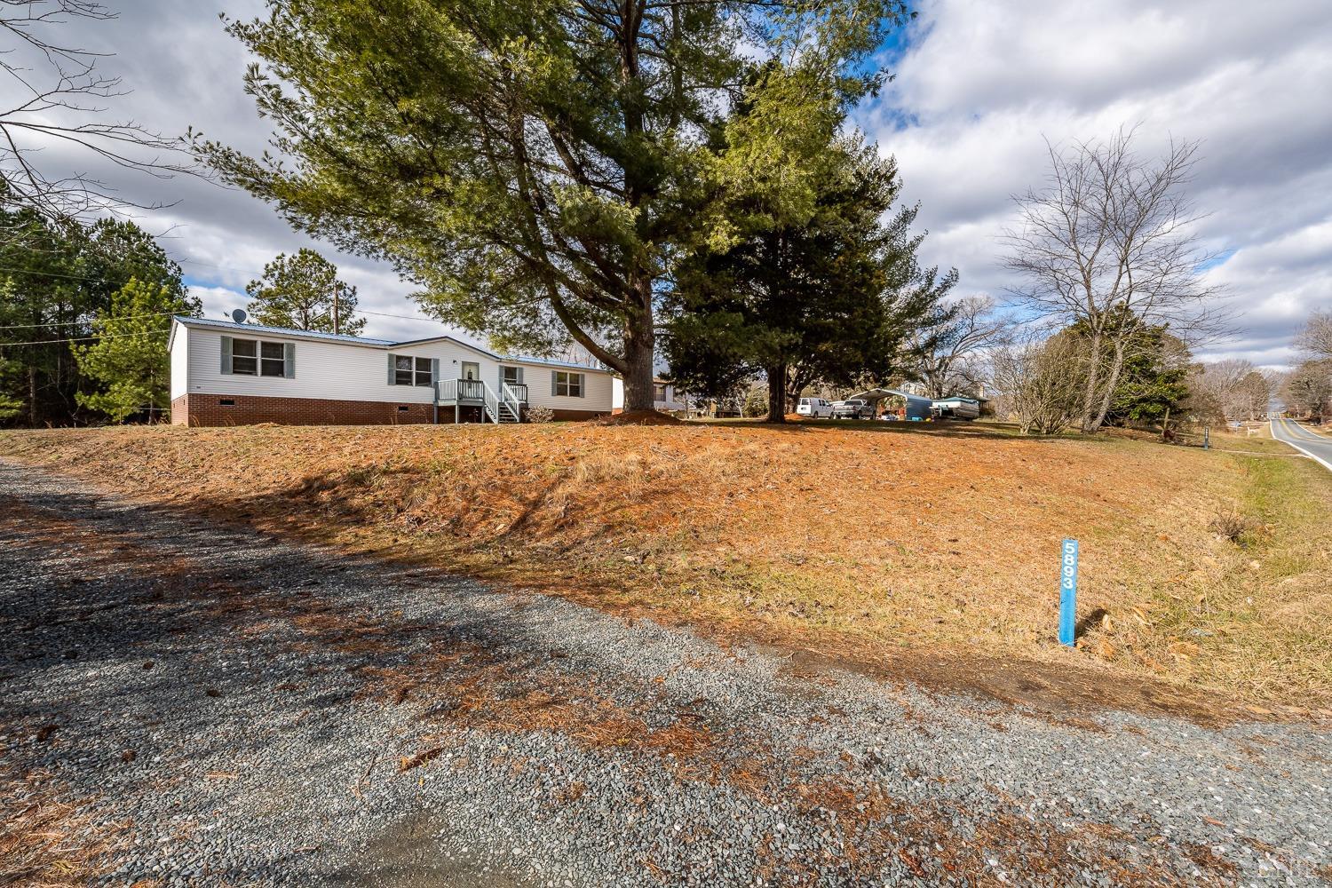 5893 Red House Road Appomattox, VA 24522 - Photo 3 of 28 a front view of house with yard and trees