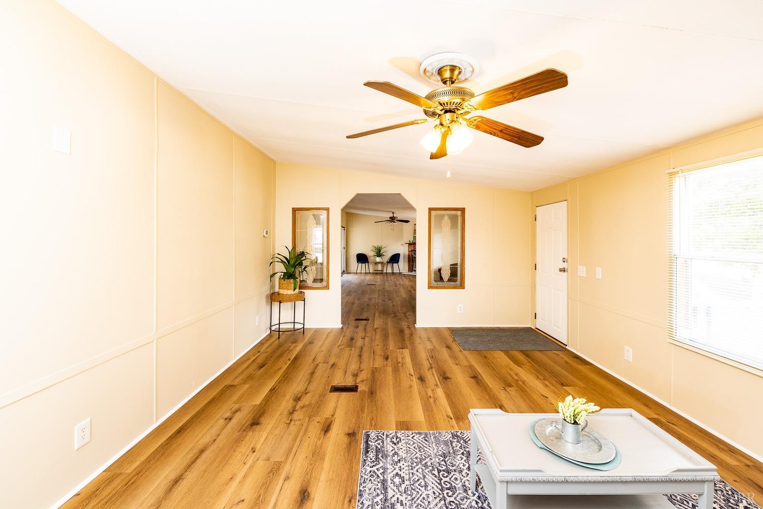 5893 Red House Road Appomattox, VA 24522 - Photo 6 of 28 a bedroom with a bed and a chandelier