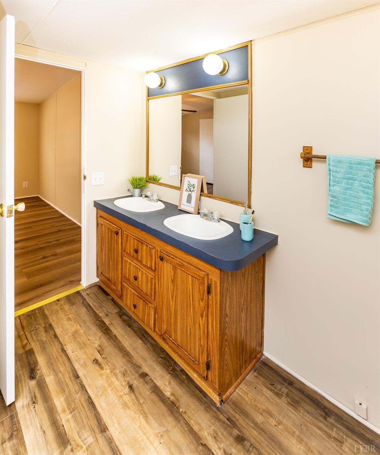 5893 Red House Road Appomattox, VA 24522 - Photo 7 of 28 a bathroom with a sink and a mirror