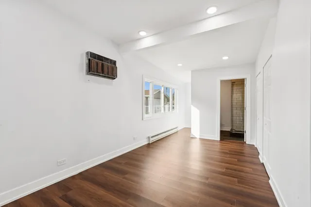 a view of a livingroom with wooden floor