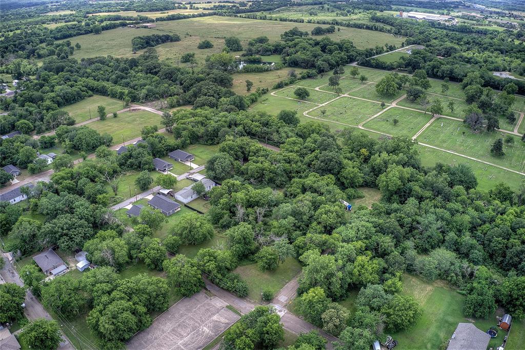 0 Sycamore Street Commerce, TX 75428 - Photo 10 of 14 an aerial view of residential houses with outdoor space and trees