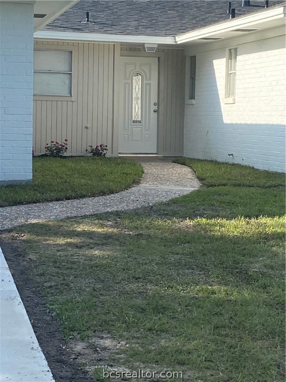 a view of a backyard of the house