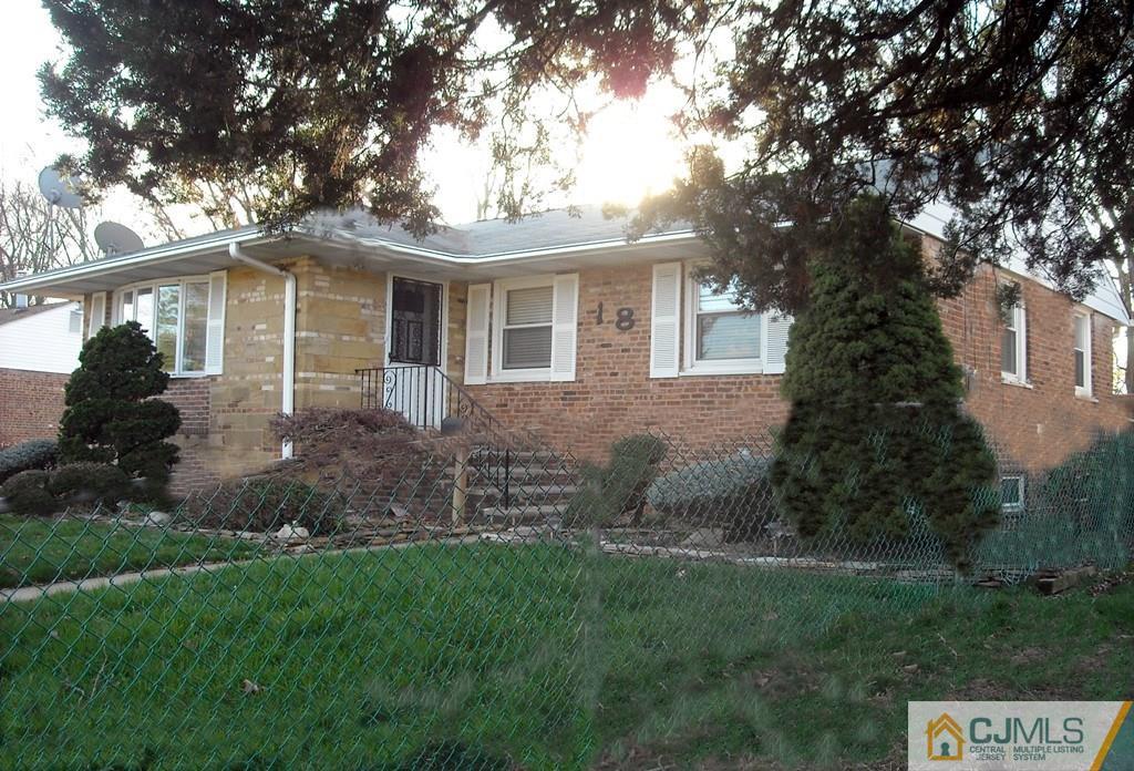 18 Gurley Road Edison, NJ 08817 - Photo 14 of 14 a front view of a house with garden