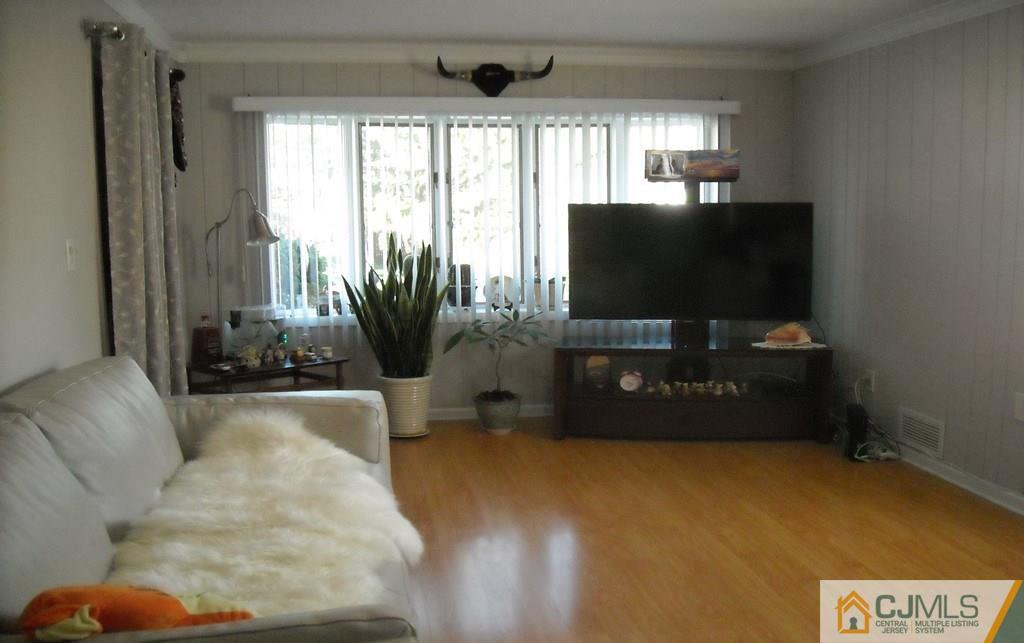 18 Gurley Road Edison, NJ 08817 - Photo 5 of 14 a living room with furniture and a flat screen tv