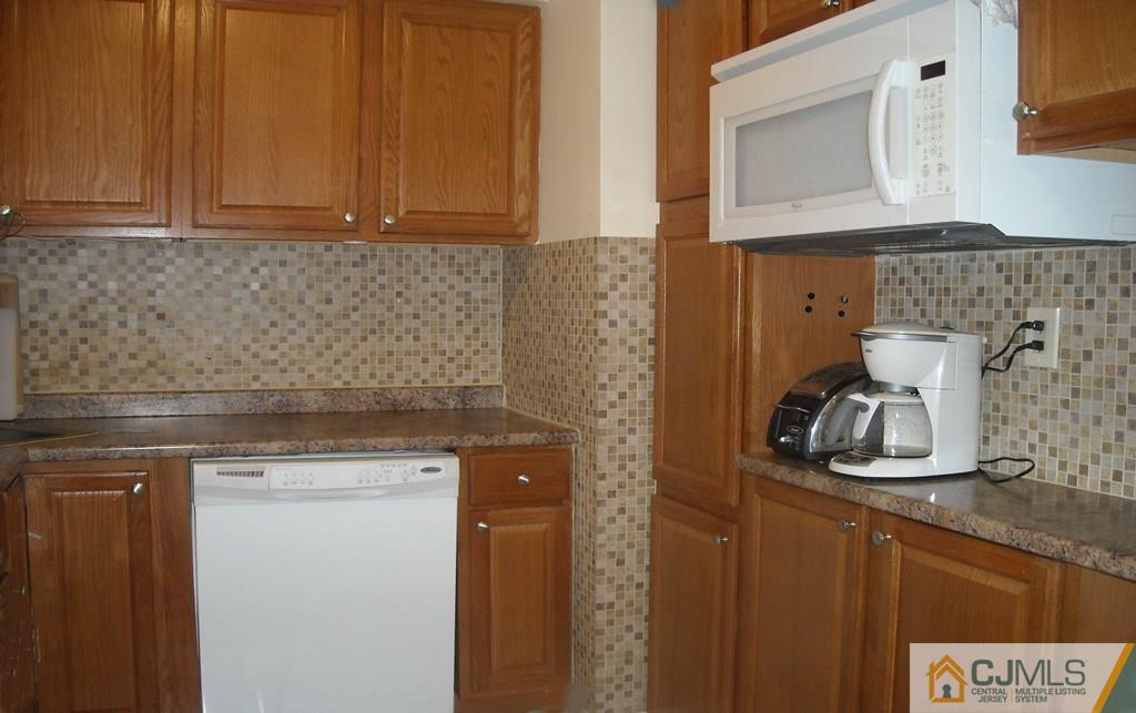 18 Gurley Road Edison, NJ 08817 - Photo 6 of 14 a kitchen with a sink and cabinets