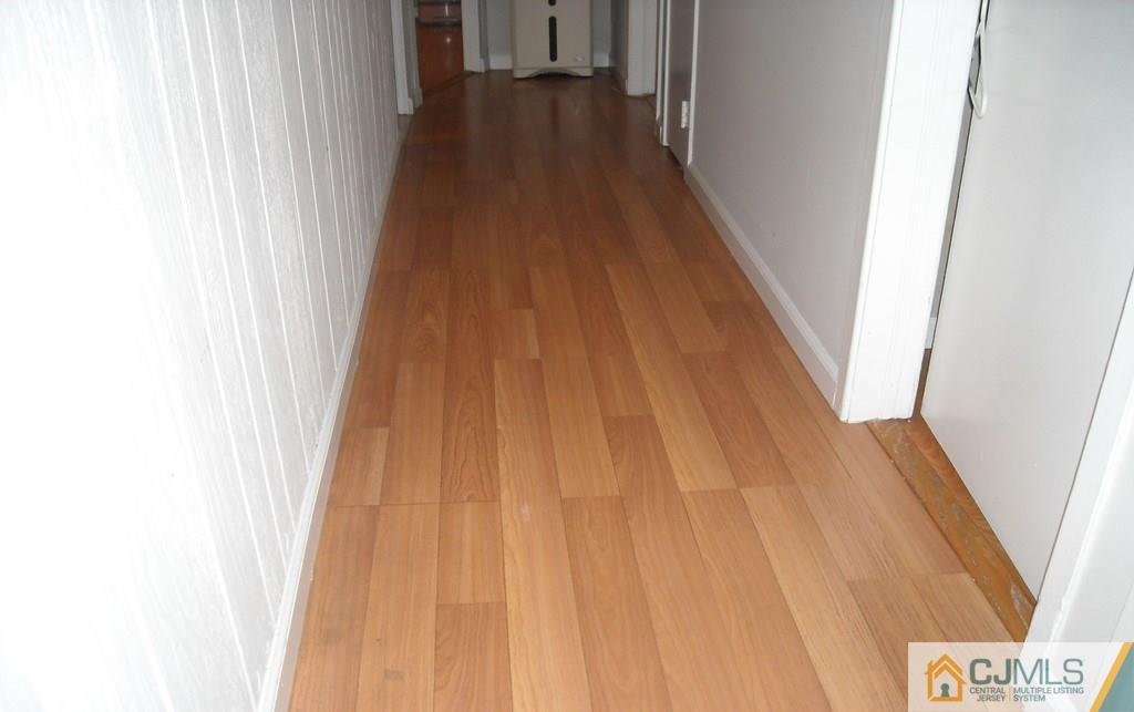 18 Gurley Road Edison, NJ 08817 - Photo 7 of 14 a view of a hallway with wooden floor