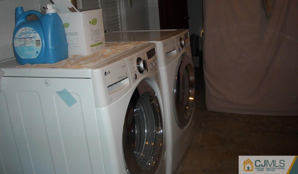 18 Gurley Road Edison, NJ 08817 - Photo 10 of 14 a utility room with dryer and washer