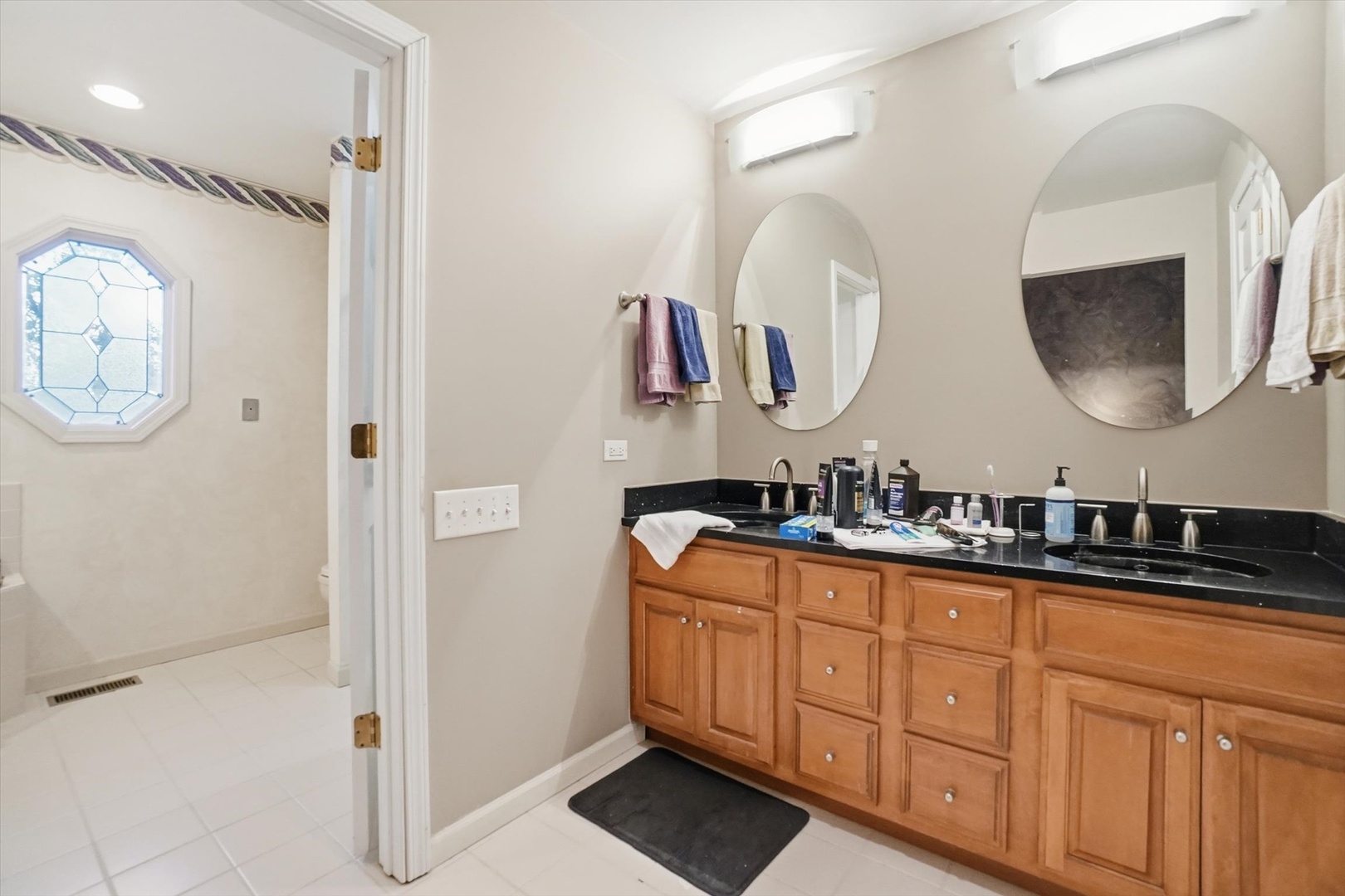 821 Killarney Pass Circle Mundelein, IL 60060 - Photo 13 of 32 a bathroom with a double vanity sink and a mirror