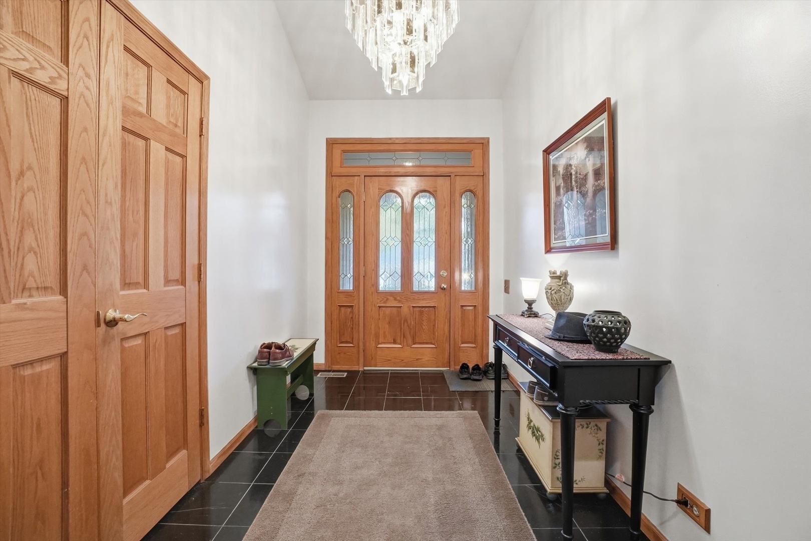 821 Killarney Pass Circle Mundelein, IL 60060 - Photo 2 of 32 a bathroom with a sink a mirror and a shower