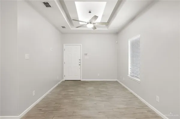 a view of an empty room with a window