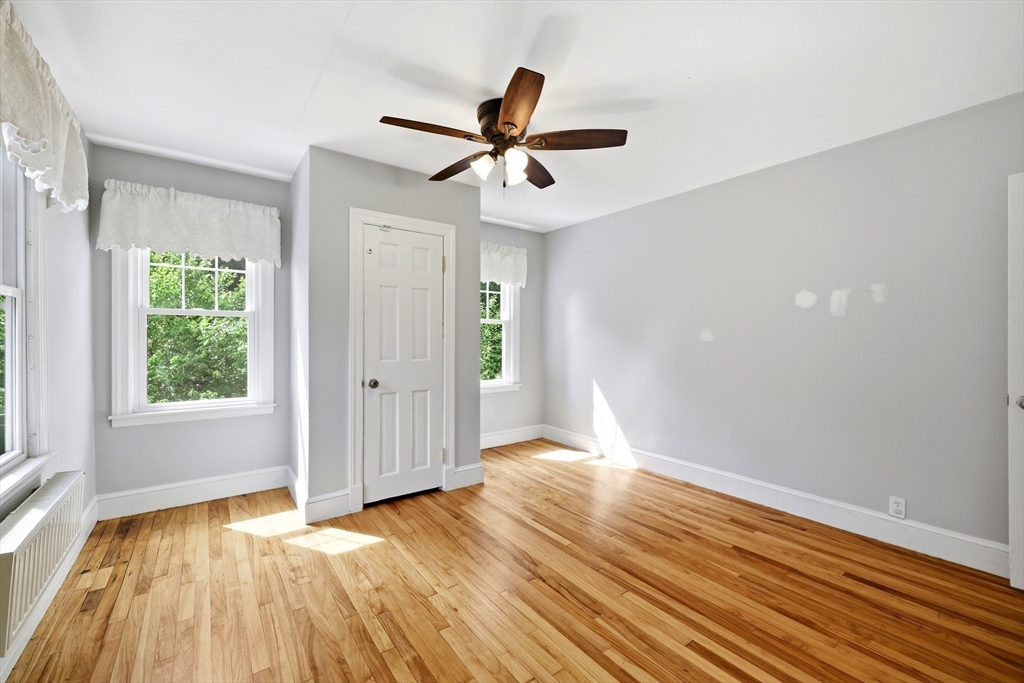 32 Lincoln Road Longmeadow, MA 01106 - Photo 24 of 36 a view of empty room with wooden floor and fan