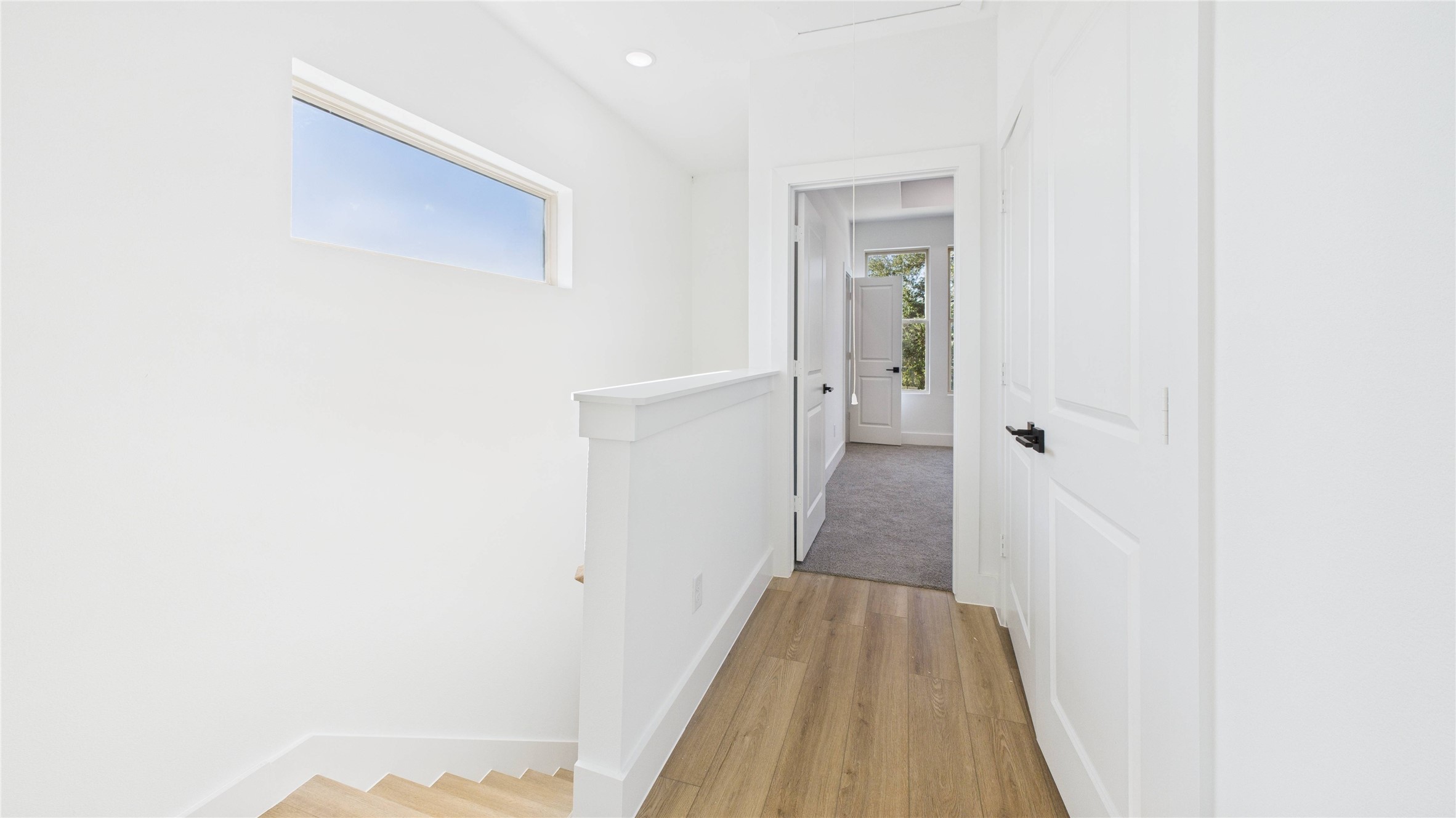 5318 Terry Street Houston, TX 77009 - Photo 16 of 28 a view of a hallway with wooden floor