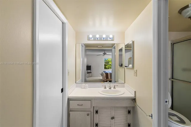 a bathroom with a sink and a mirror