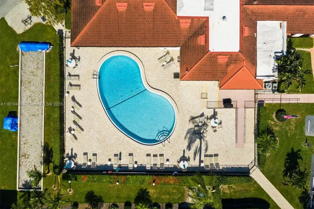 an aerial view of a house with a garden and plants