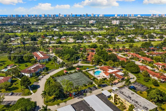 an aerial view of residential houses with outdoor space