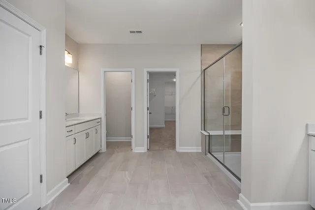 wooden floor with white walls