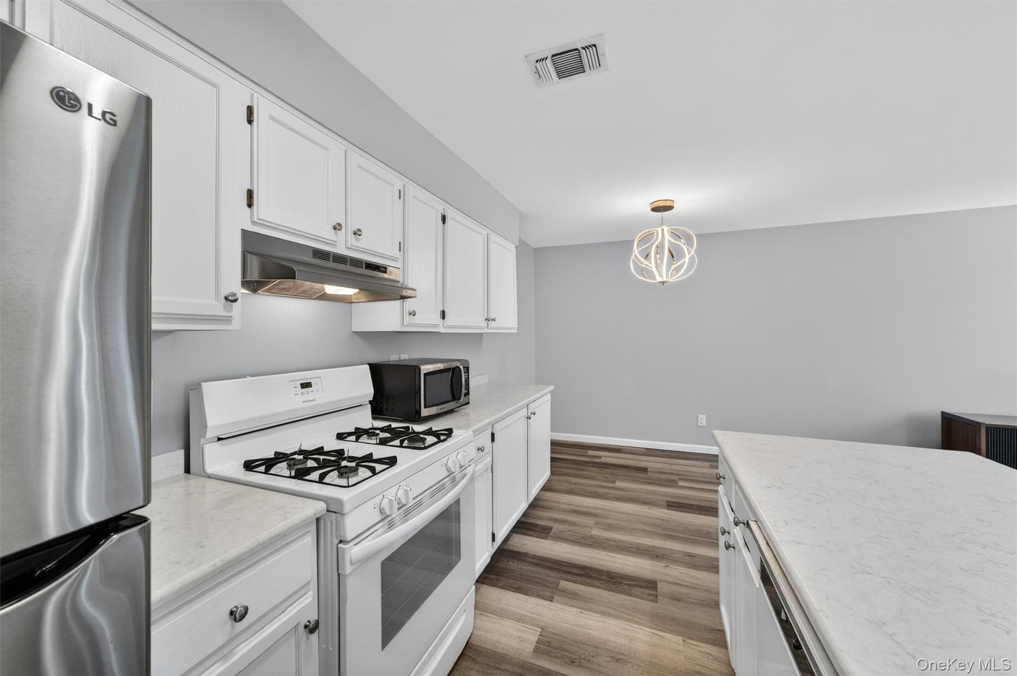 43 The Rise Warwick, NY 10990 - Photo 25 of 49 a kitchen with granite countertop a sink stove and refrigerator