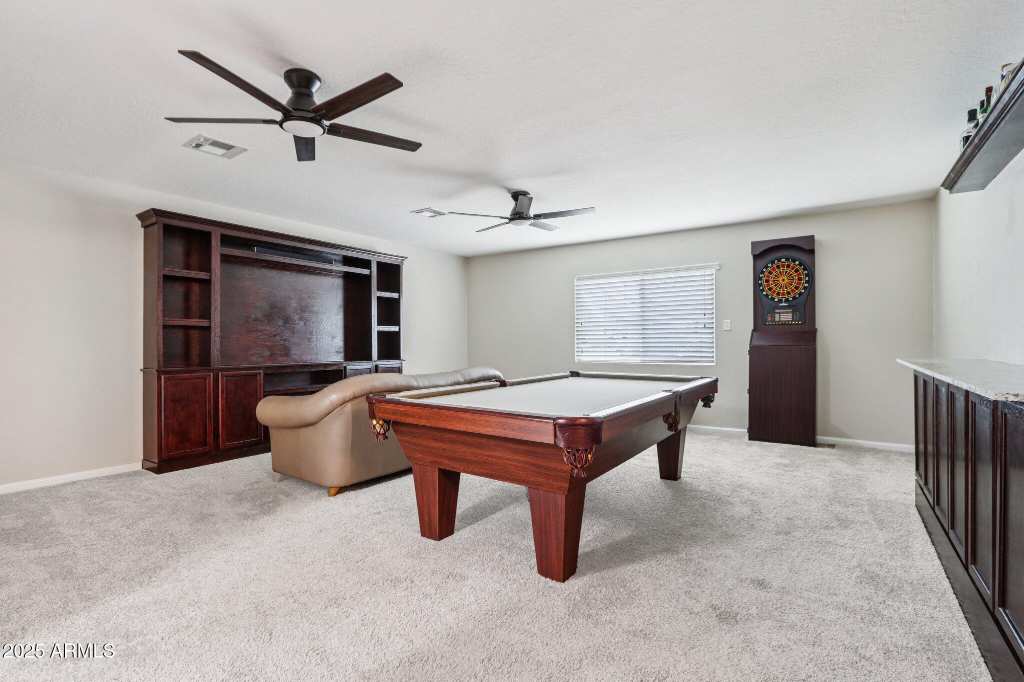 127 East Garfield Street Tempe, AZ 85288 - Photo 12 of 60 a living room with furniture a window and a flat screen tv