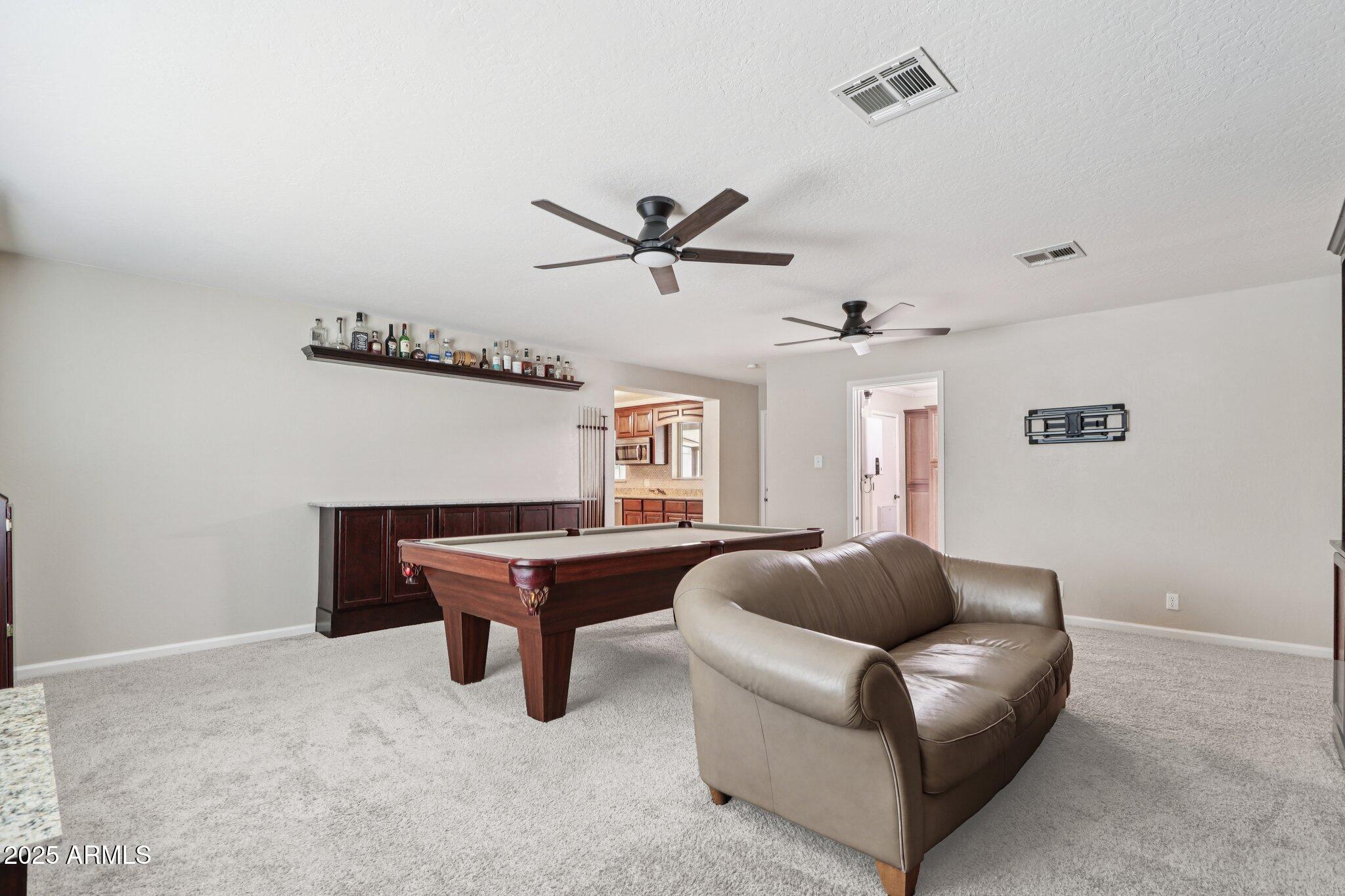 127 East Garfield Street Tempe, AZ 85288 - Photo 14 of 60 a living room with furniture and a ceiling fan
