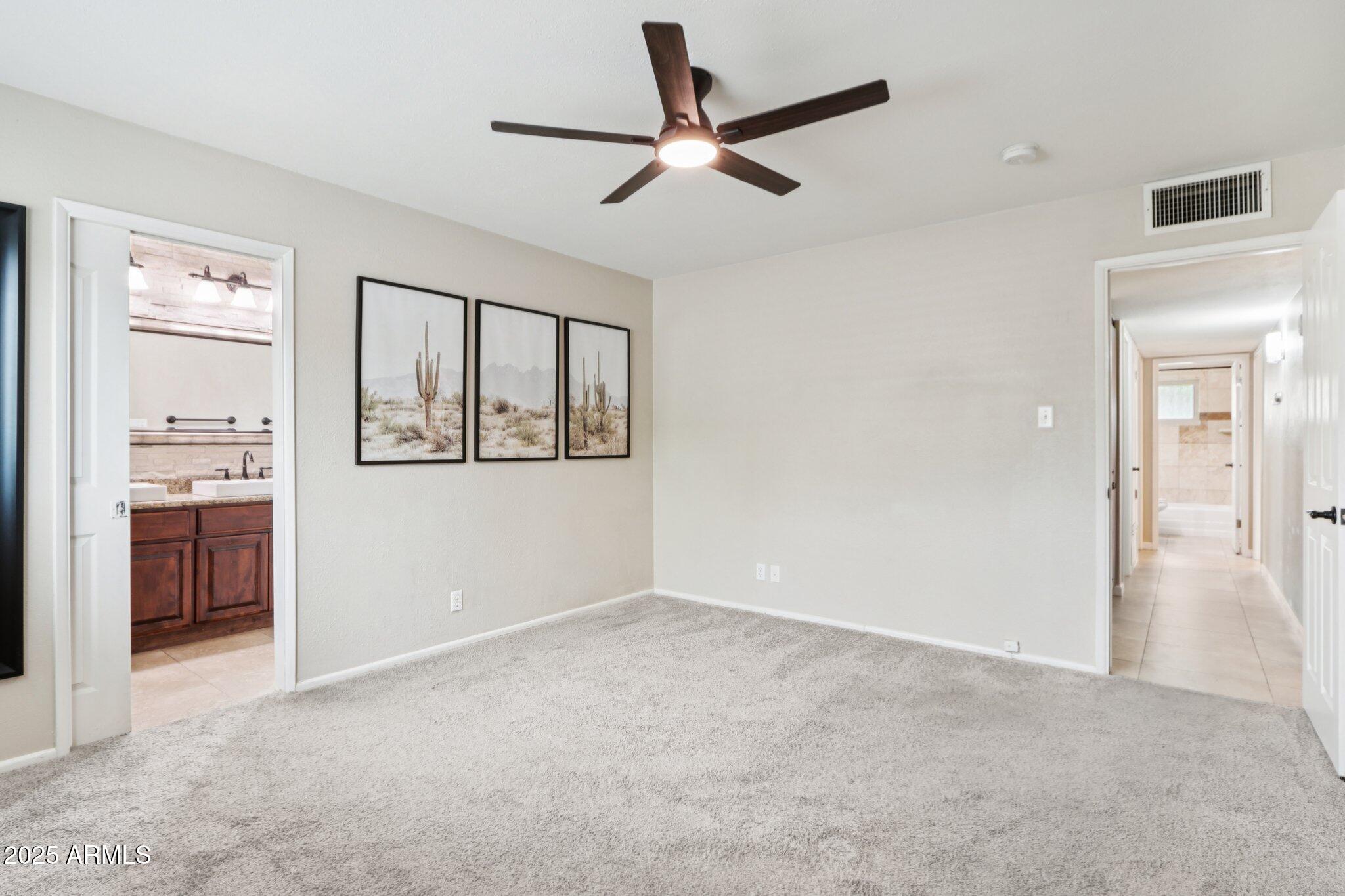 127 East Garfield Street Tempe, AZ 85288 - Photo 15 of 60 a view of empty room with a ceiling fan