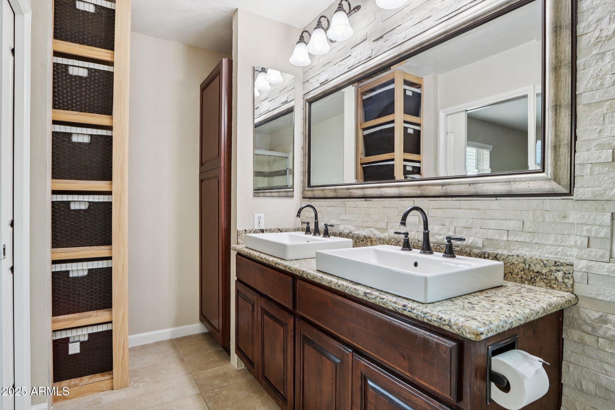 127 East Garfield Street Tempe, AZ 85288 - Photo 19 of 60 a bathroom with a granite countertop double vanity and a mirror