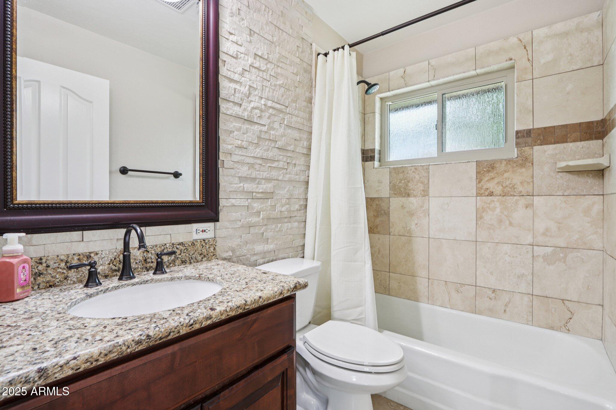 127 East Garfield Street Tempe, AZ 85288 - Photo 25 of 60 a bathroom with a granite countertop sink toilet and shower
