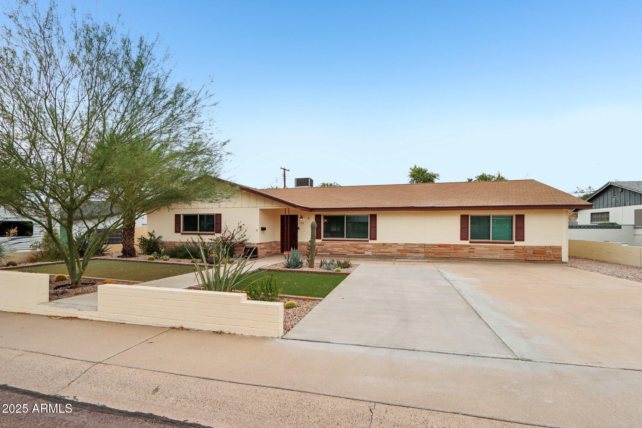 127 East Garfield Street Tempe, AZ 85288 - Photo 32 of 60 a view of a yard in front of a house