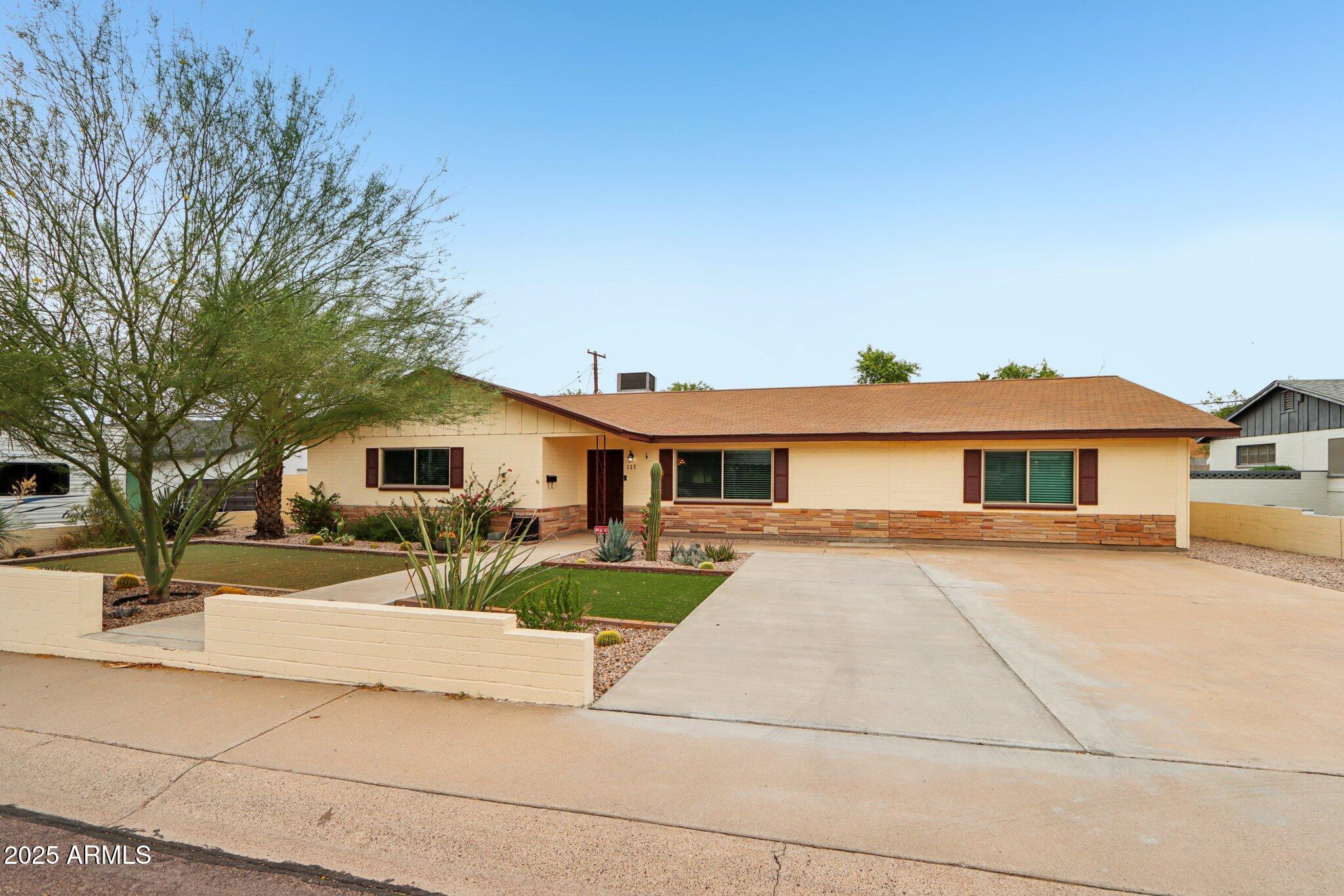 127 East Garfield Street Tempe, AZ 85288 - Photo 34 of 60 a view of a yard in front of a house