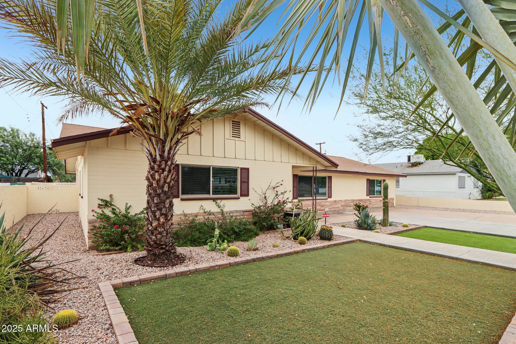 127 East Garfield Street Tempe, AZ 85288 - Photo 38 of 60 a front view of house with yard and outdoor seating