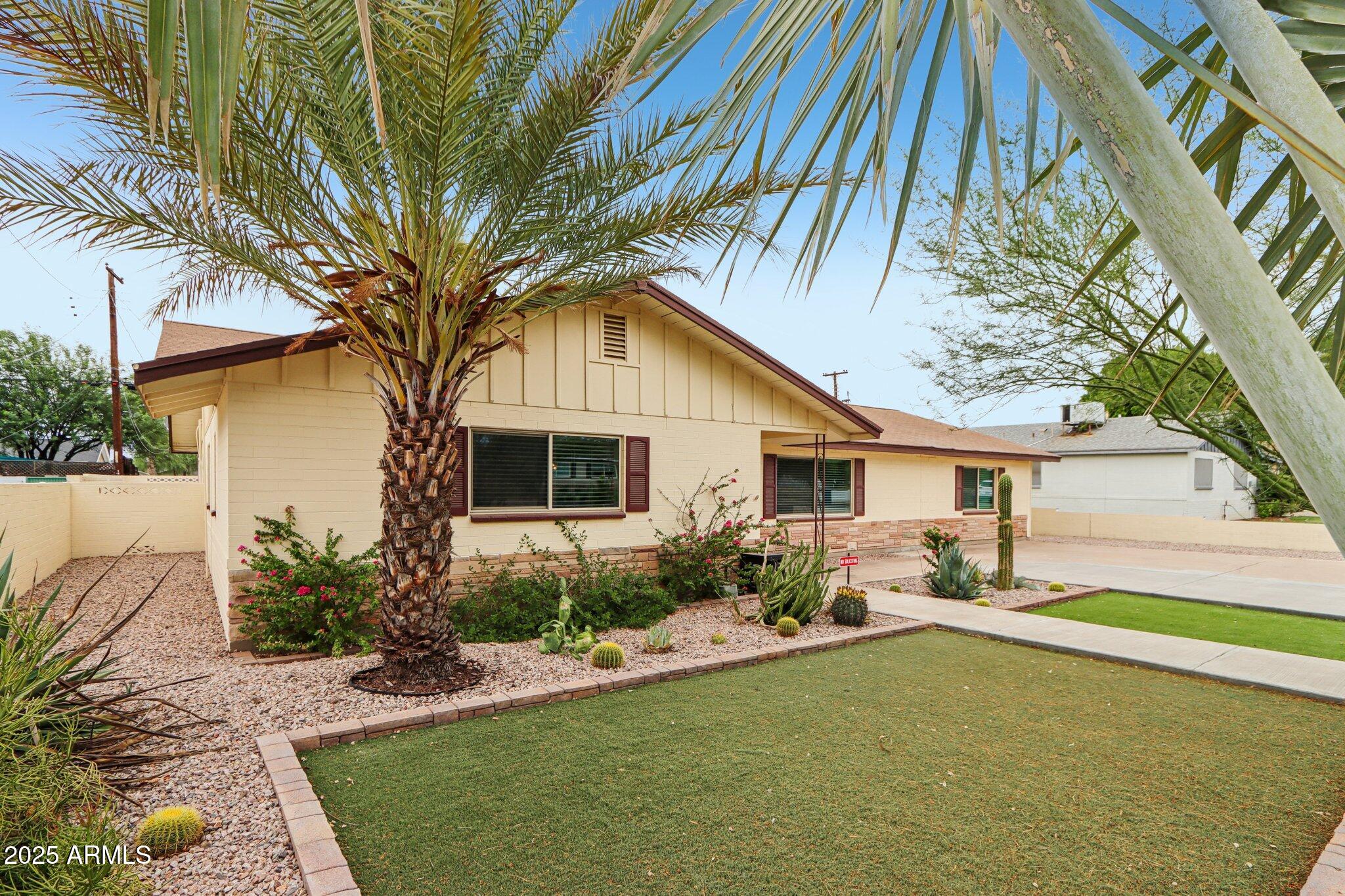 127 East Garfield Street Tempe, AZ 85288 - Photo 39 of 60 a house view with a garden space