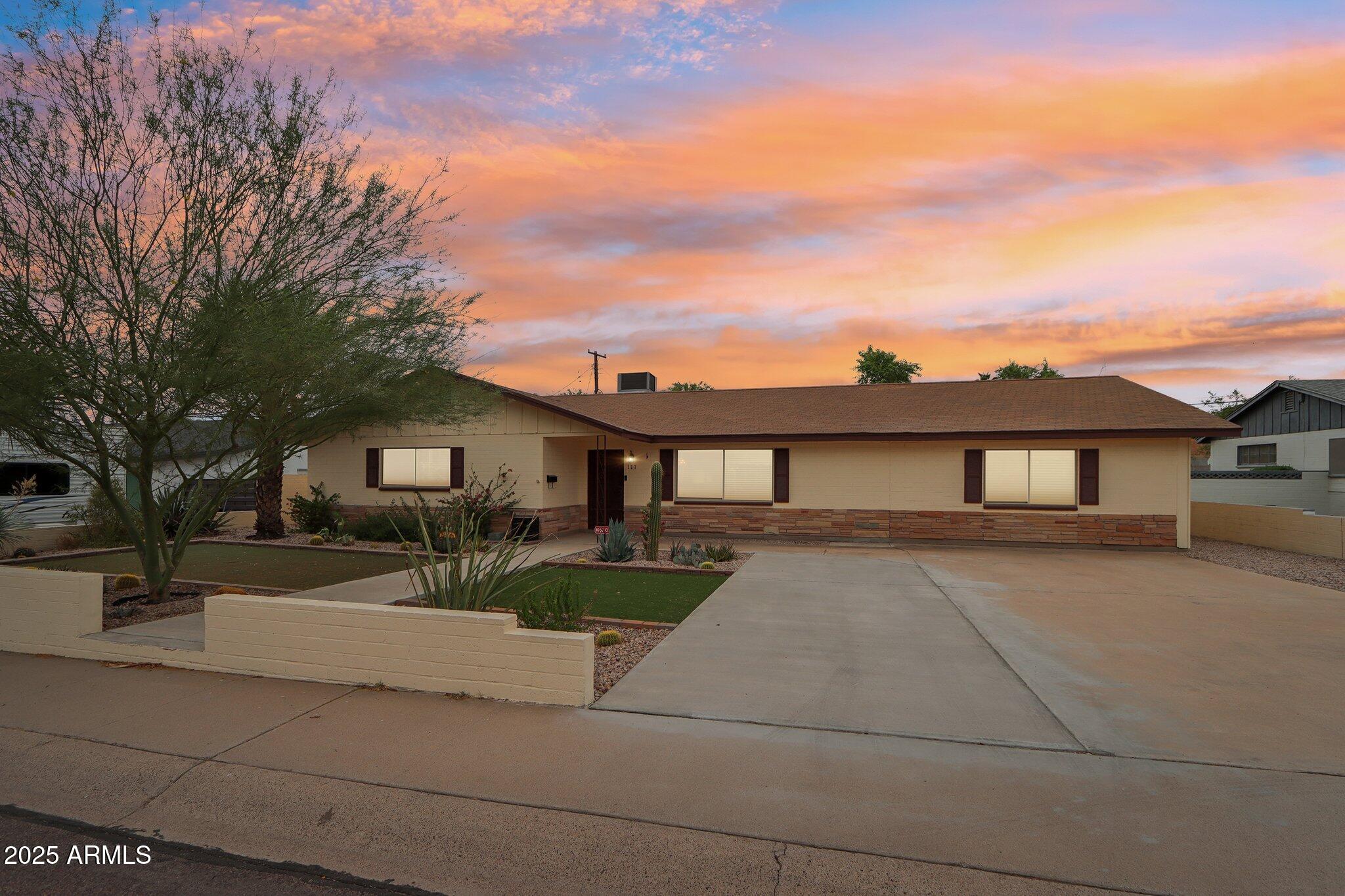 127 East Garfield Street Tempe, AZ 85288 - Photo 40 of 60 a front view of a house with a yard and garage