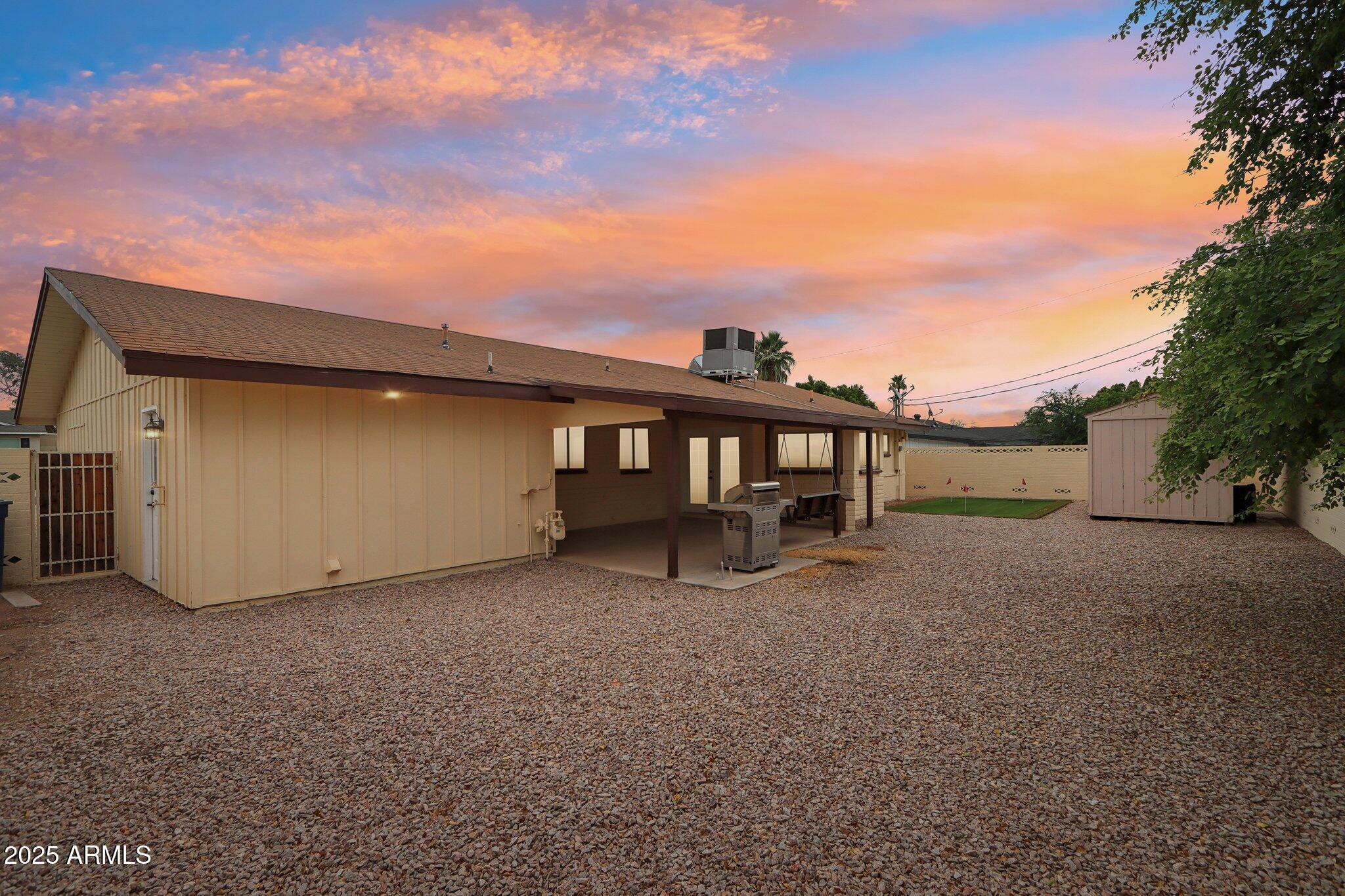 127 East Garfield Street Tempe, AZ 85288 - Photo 43 of 60 a view of a house with a yard