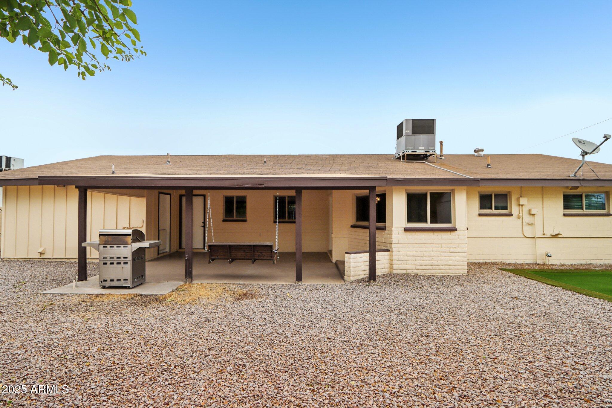 127 East Garfield Street Tempe, AZ 85288 - Photo 44 of 60 a front view of a house with garden