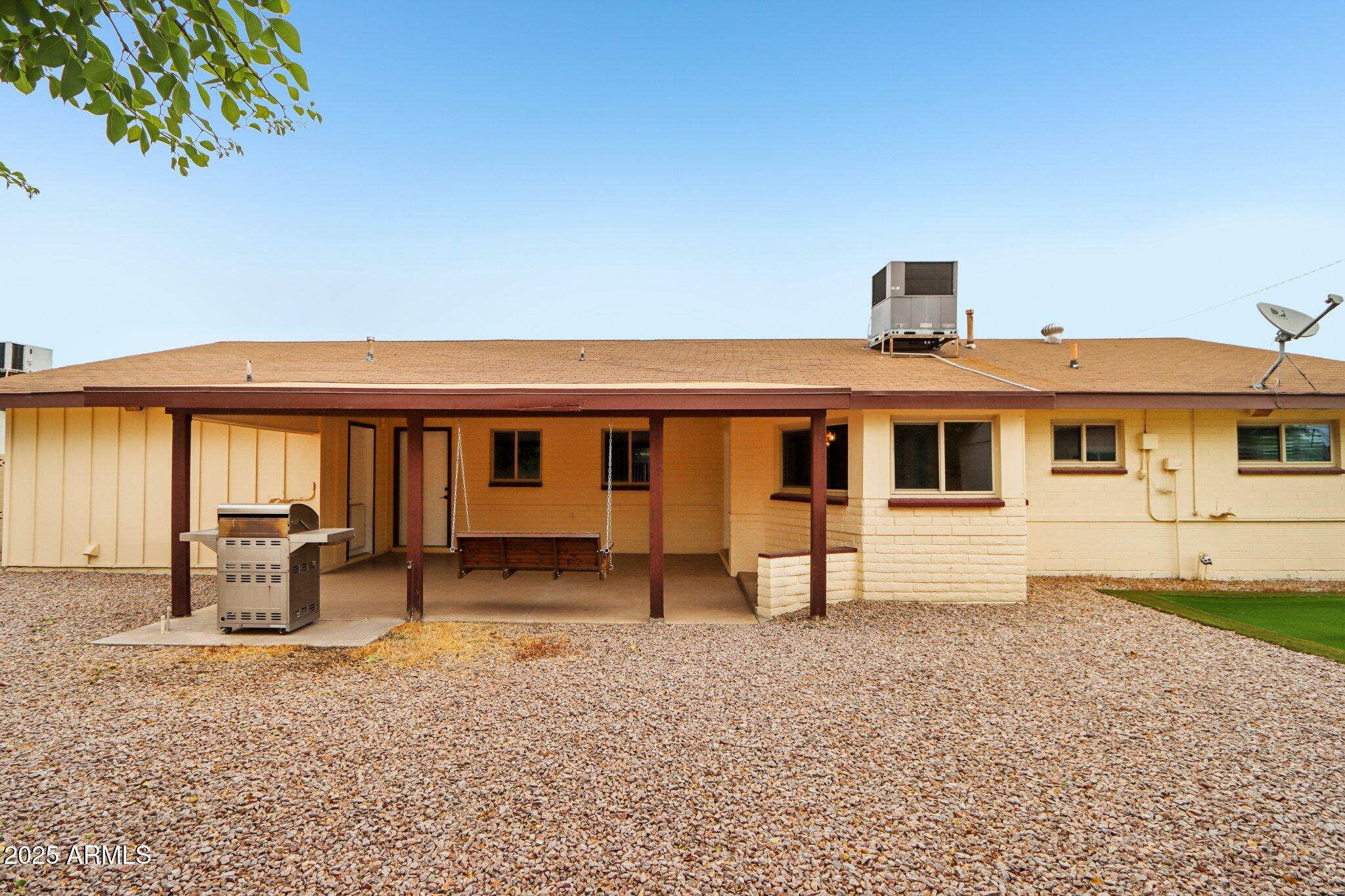 127 East Garfield Street Tempe, AZ 85288 - Photo 47 of 60 a front view of a house with a yard and seating space