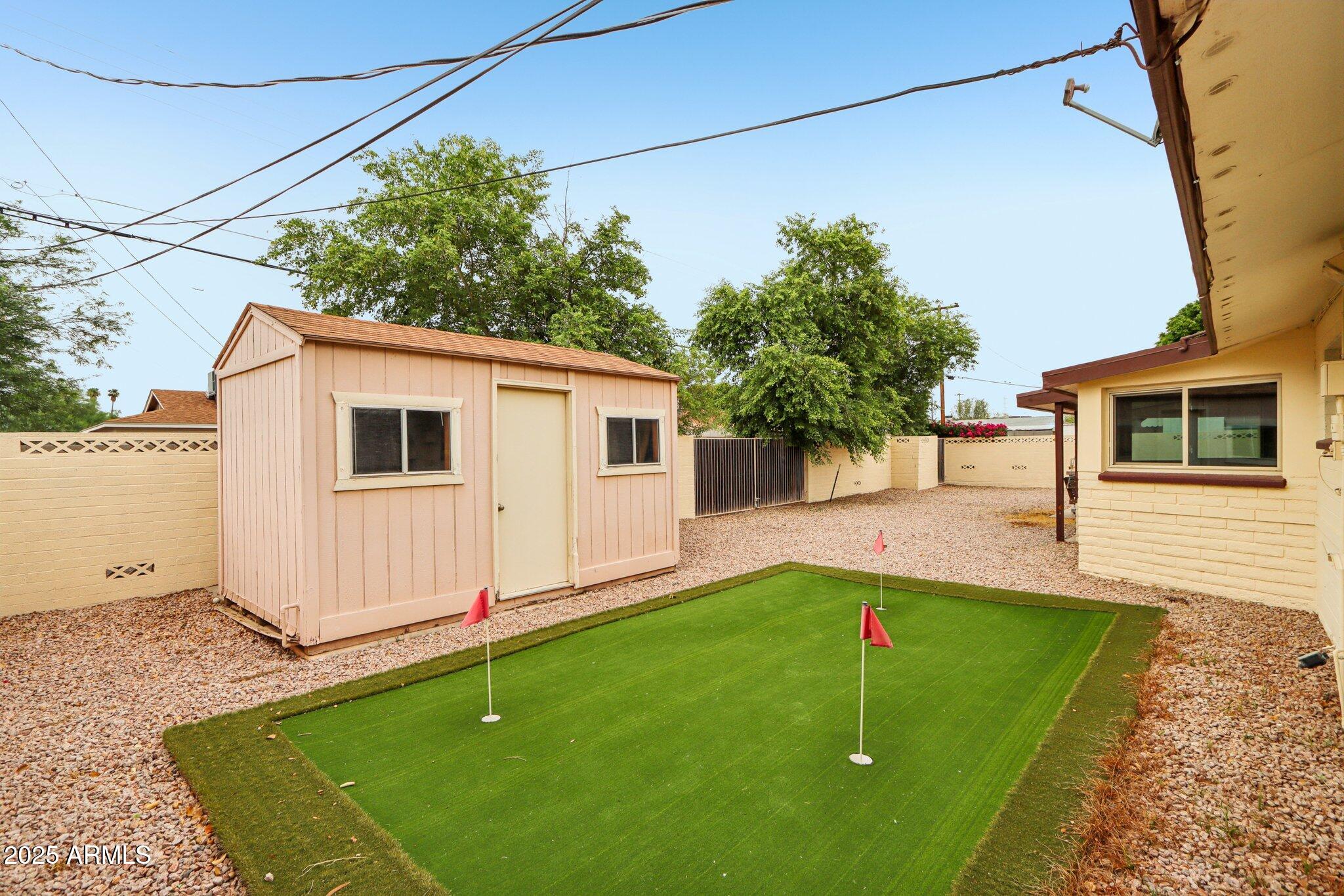 127 East Garfield Street Tempe, AZ 85288 - Photo 48 of 60 a backyard of a house with seating space