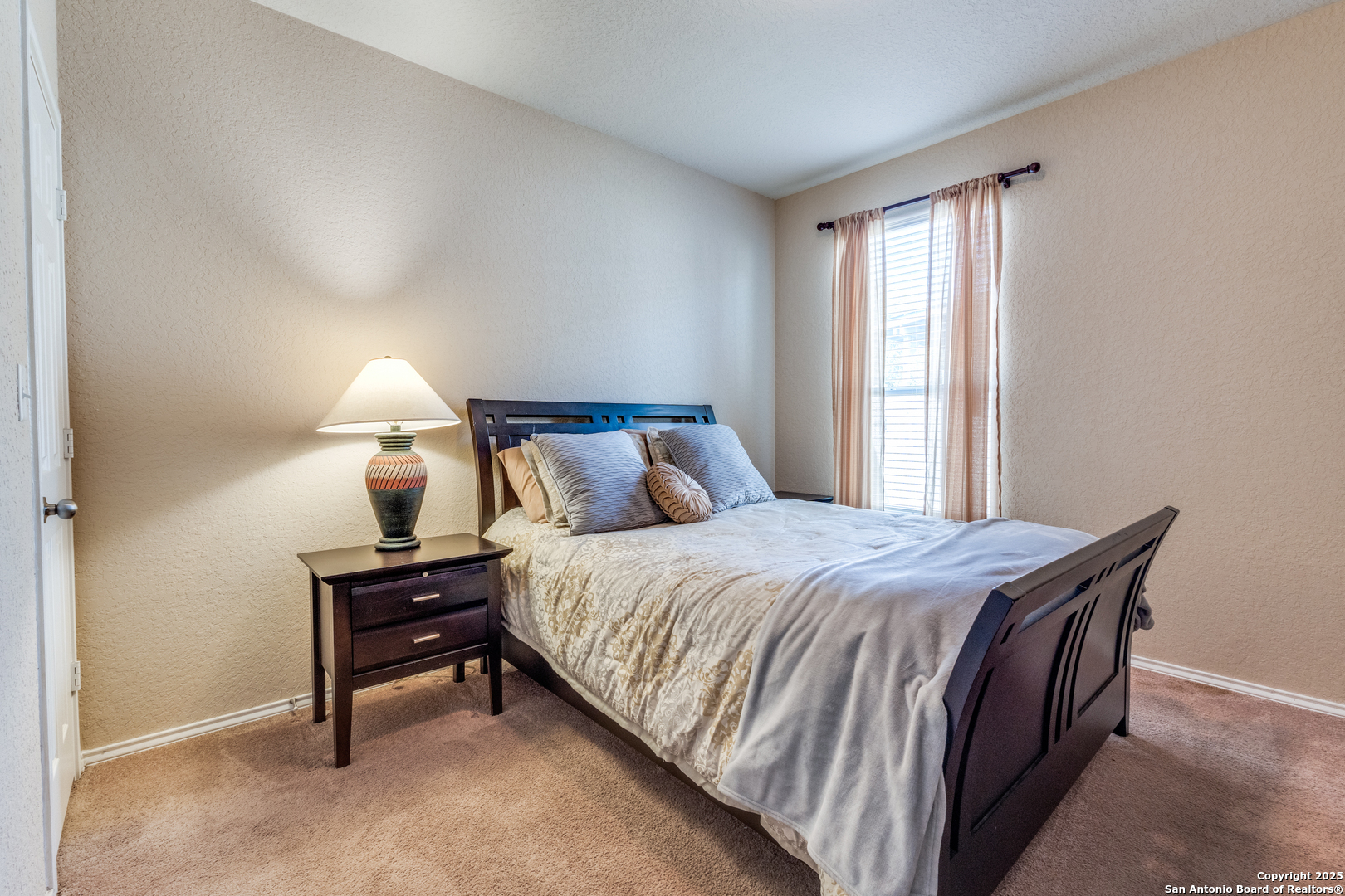 15923 Silver Rose Selma, TX 78154 - Photo 15 of 19 a bedroom with a bed and window